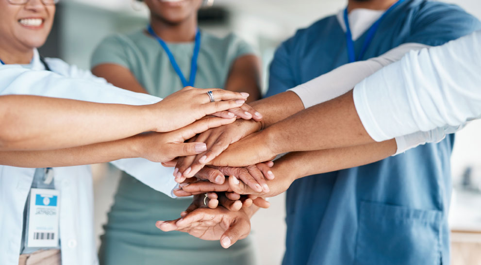 Skilled nursing team putting their hands together | Presbyterian Village Athens Caregivers putting their hands together | Presbyterian Village Athens